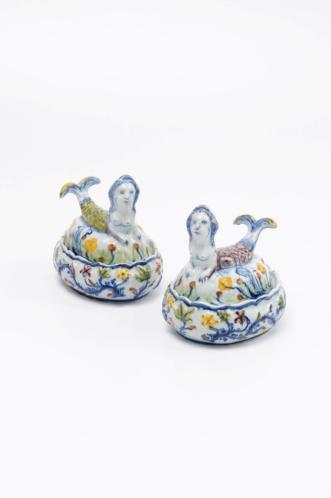 Dutch Delftware pottery polychrome mermaid form butter tubs