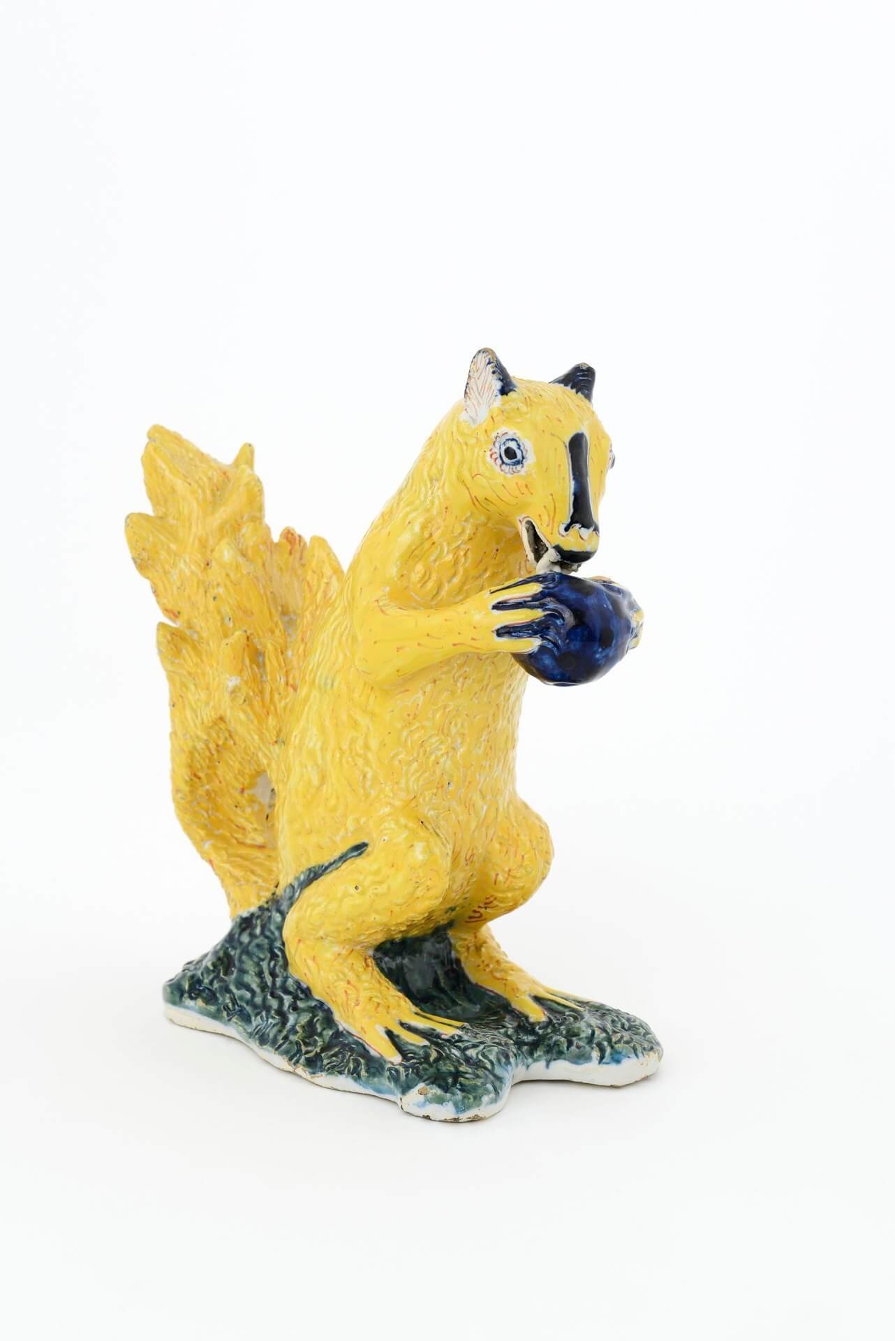 Antique Delft pottery polychrome figurine of a squirrel