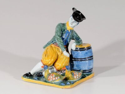 Antique Polychrome Figurine Of Man Hanging On Barrel