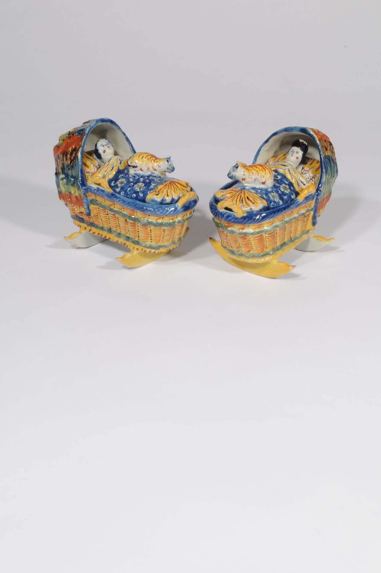 Delft ceramic polychromes figures of baby in cradle