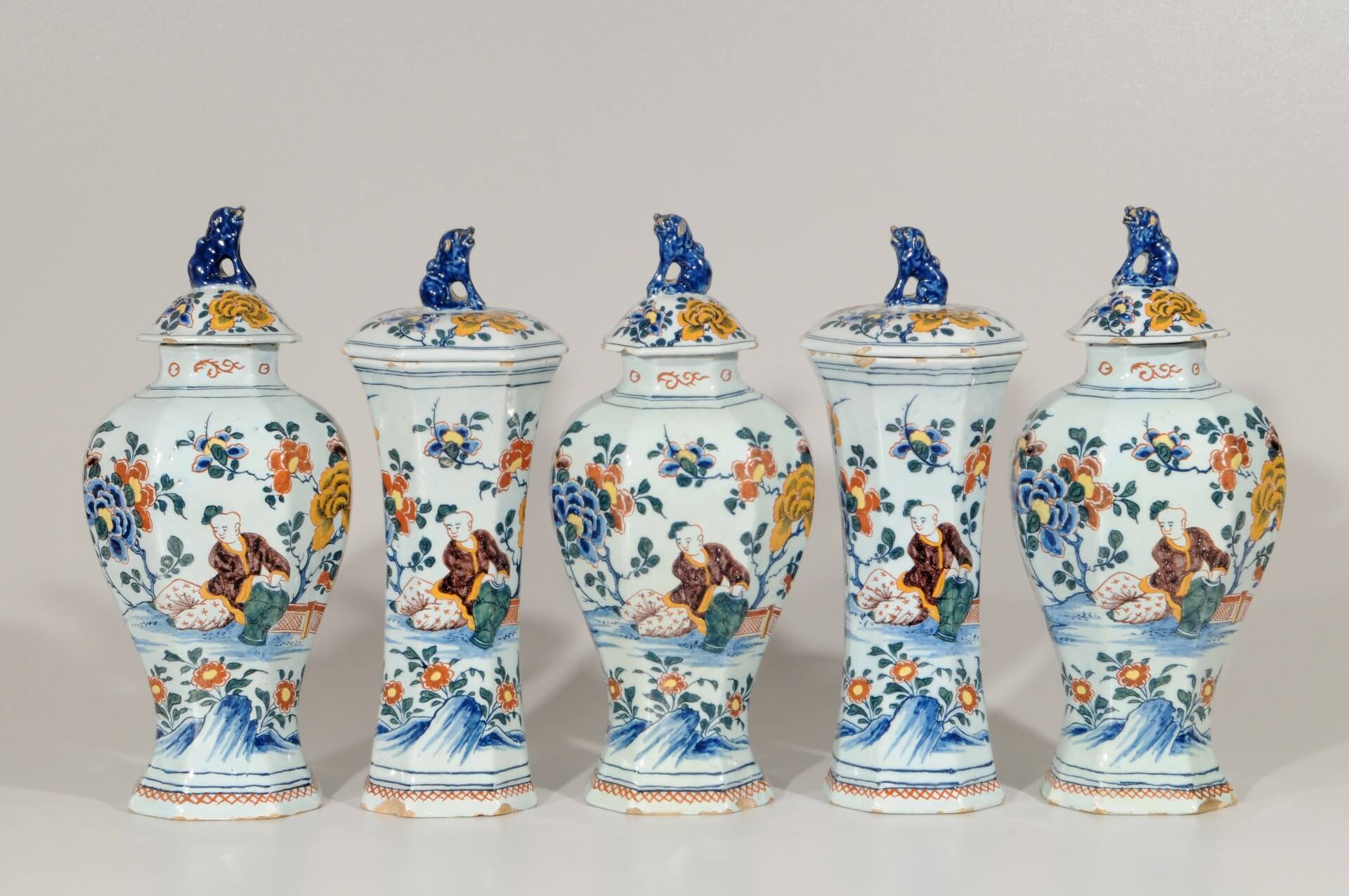 Garniture of polychrome vases antique Delft pottery