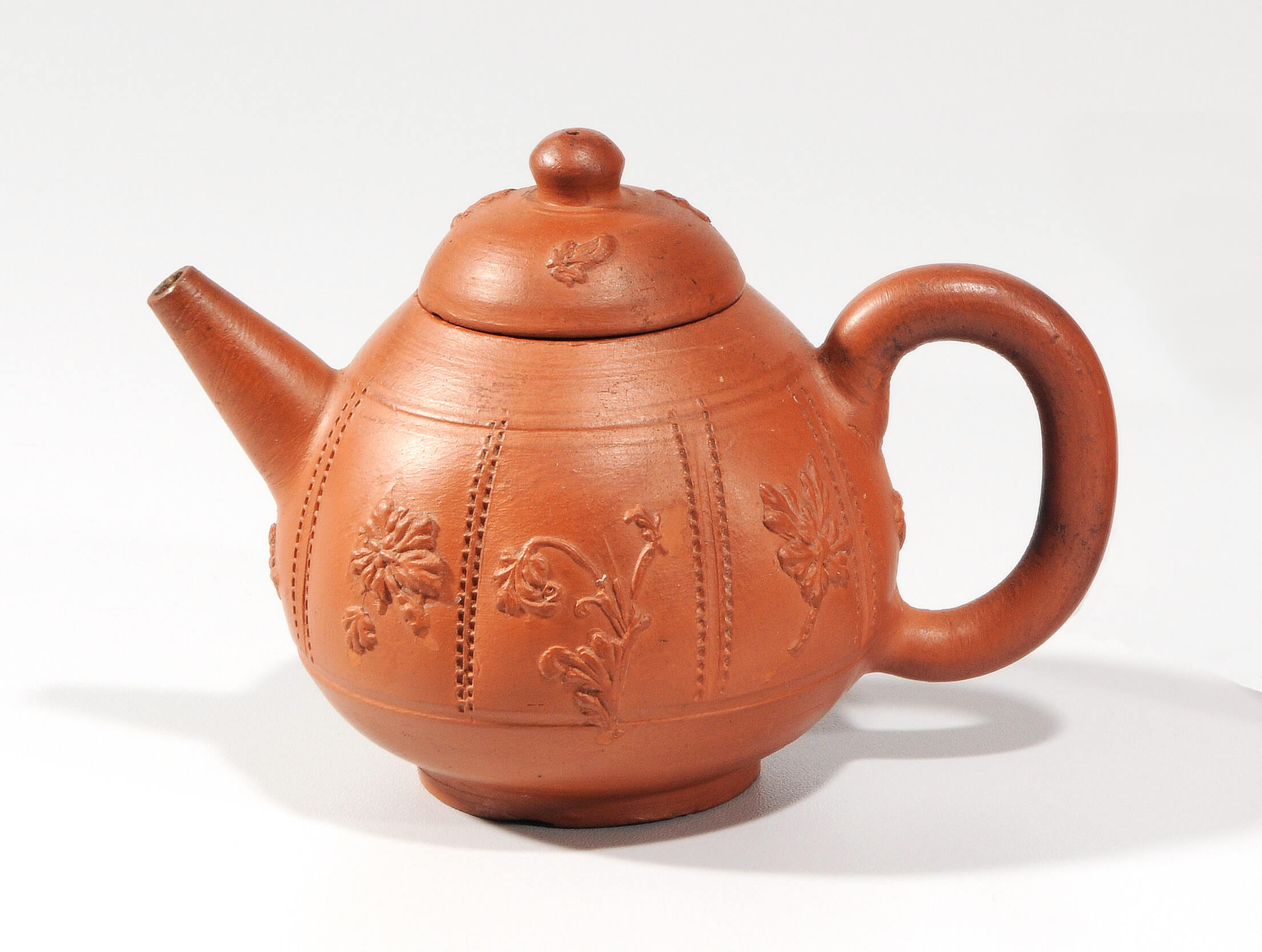 Antique red stoneware teapots explained by Aronson Antiquairs