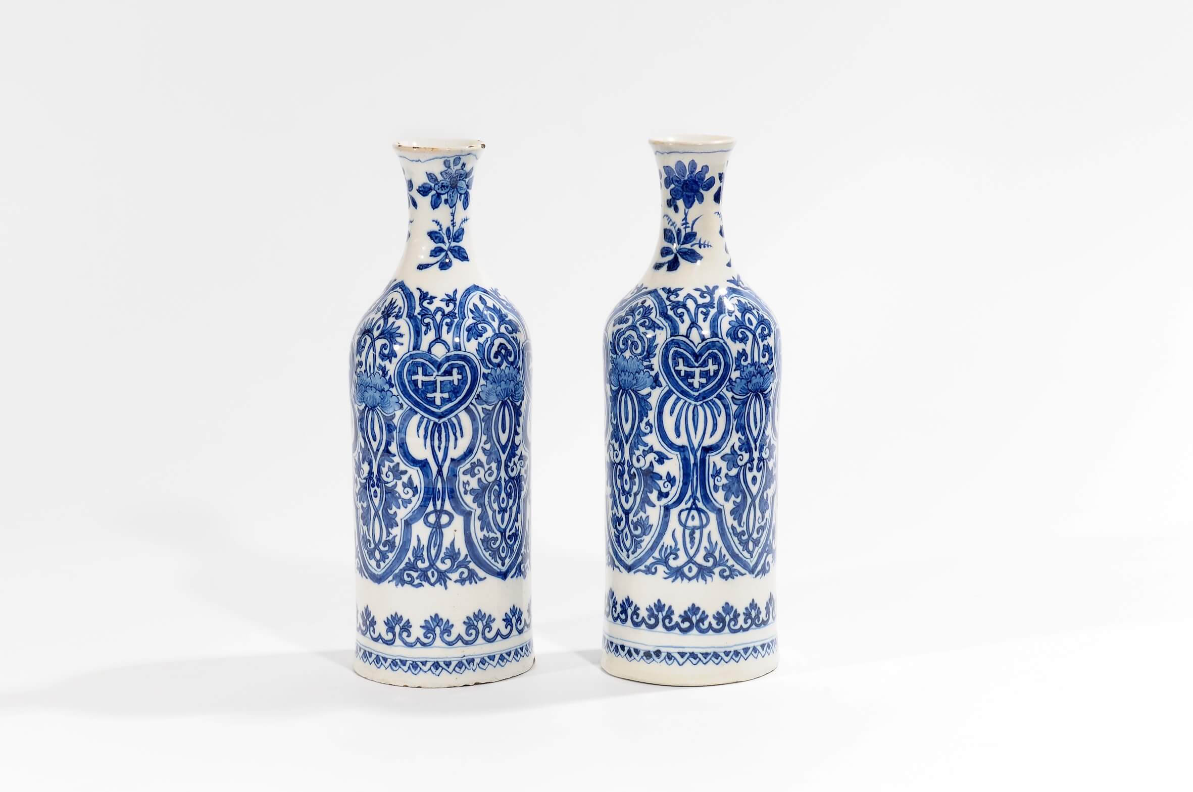 Blue and white Delftware bottle vases inspired by Kangxi patterns