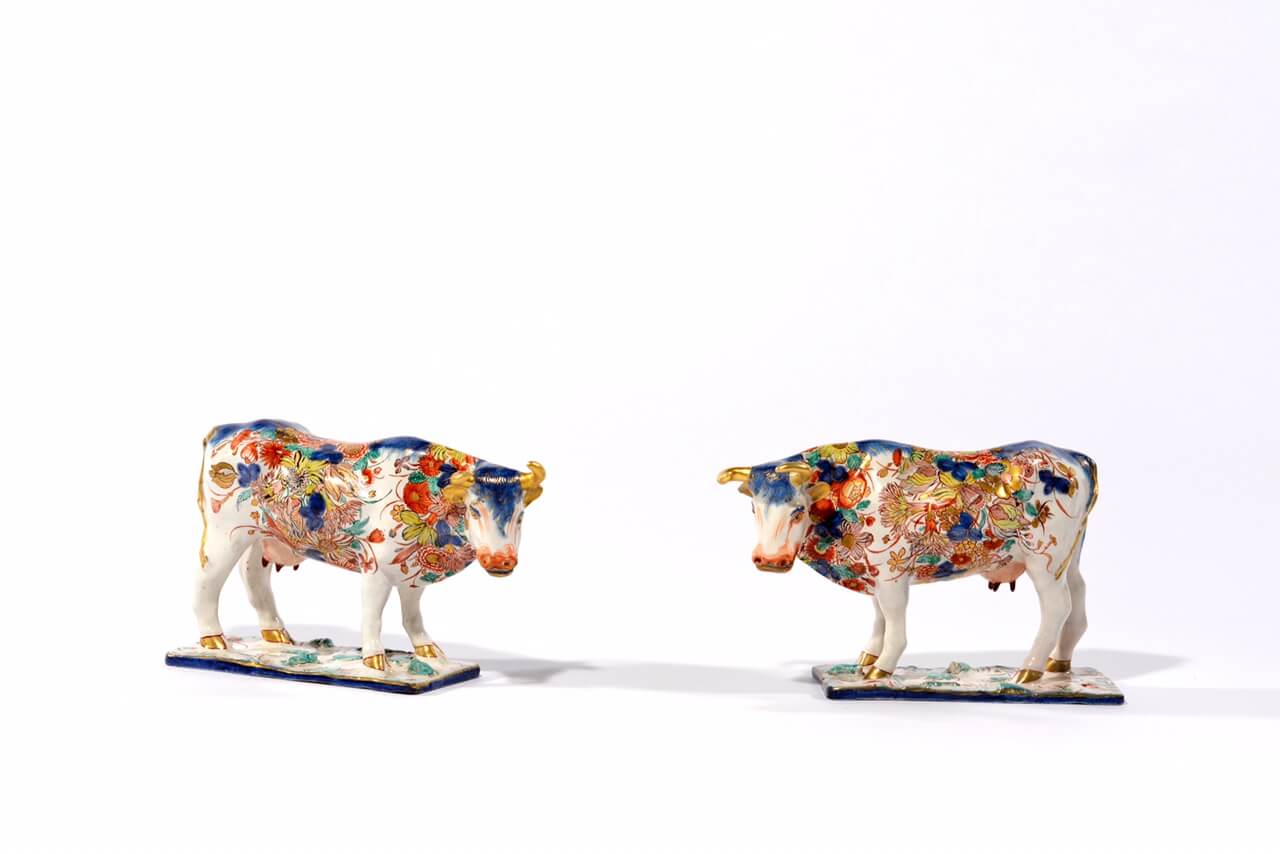 • D1617. Pair of ‘Petit Feu’ Polychrome and Gilded Figures of Cows