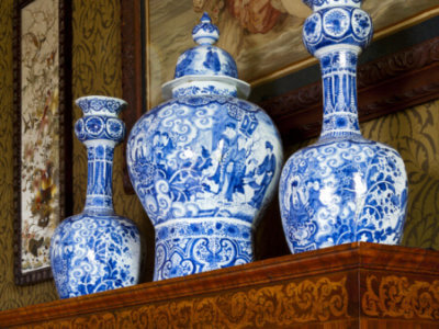 Garniture Of Three Blue-and-white Baluster Delft Vases, Painted With Figures In The Chinese Transitional Style