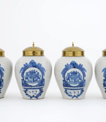 D1368. Set Of Four Blue And White Armorial Tobacco Jars And Brass Covers