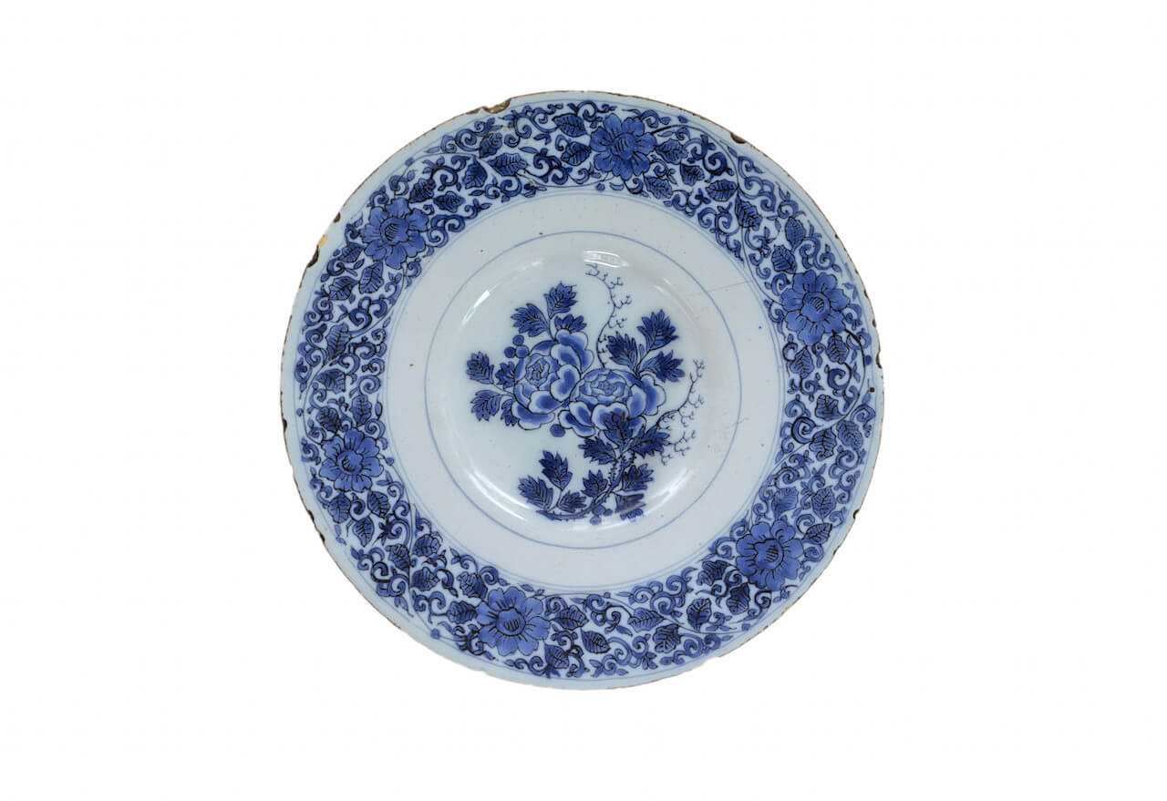 delftware blue and white plate with roses