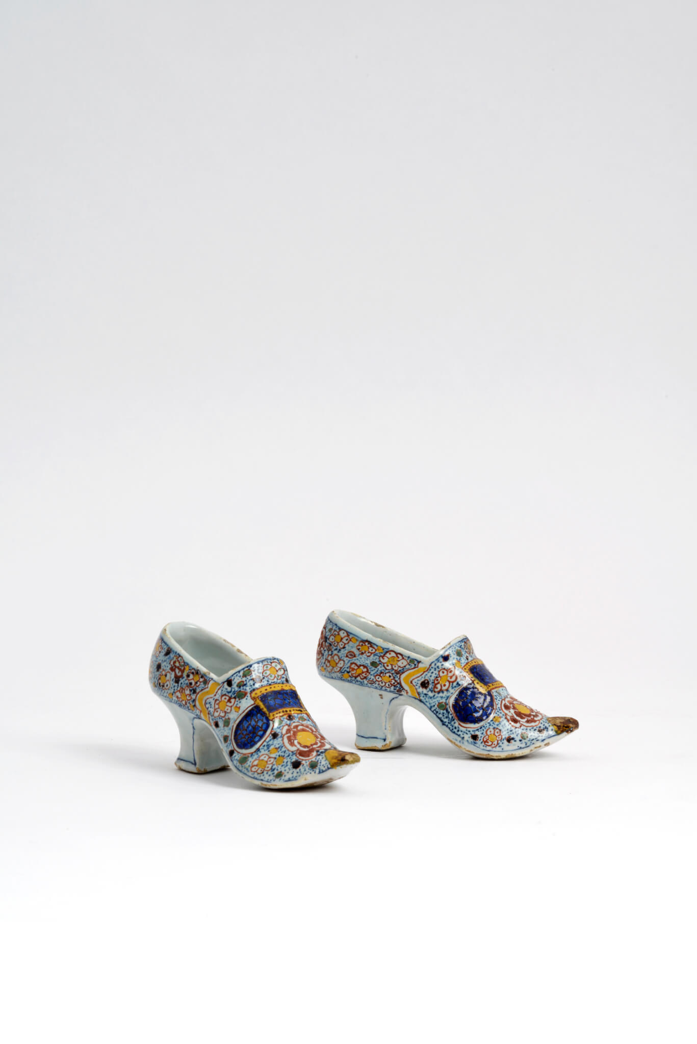 antique pair of polychrome shoes