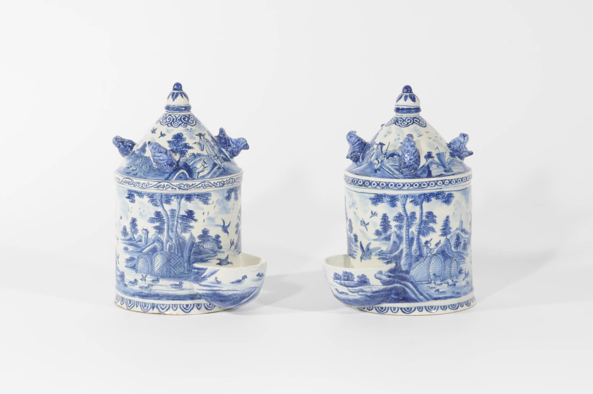 •D1050. Pair of Blue and White Aviary Water Dispensers