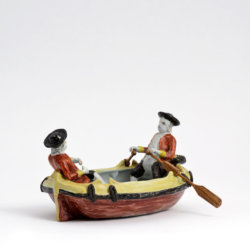 1976. Polychrome Group of Two Gentlemen in a Boat
