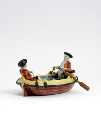 D1976. Polychrome Group Of Two Gentlemen In A Boat