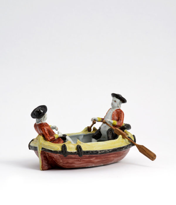 D1976. Polychrome Group of Two Gentlemen in a Boat