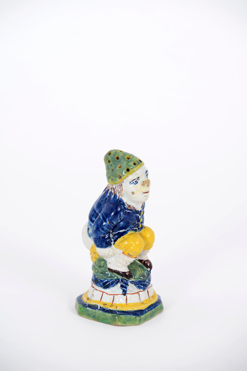 1979. Polychrome Figure of a Defecating Man