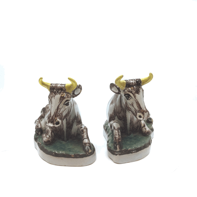 Pair of polychrome models of recumbent cows
