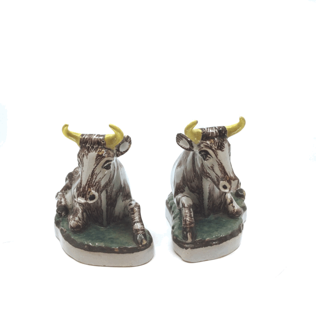 1959 Pair of polychrome models of recumbent cows Pair of polychrome models of recumbent cows
