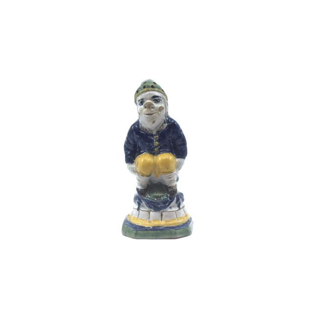 Object no. D1979 Polychrome figure of a defecating man Polychrome figure of a defecating man