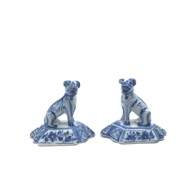 Pair of blue and white figures of seated dogs
