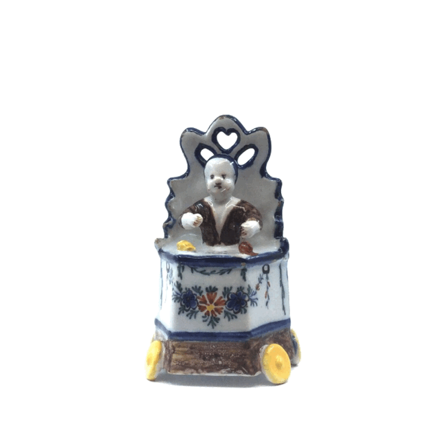 Object no. D1939 Polychrome model of a child in a high chair Polychrome model of a child in a high chair
