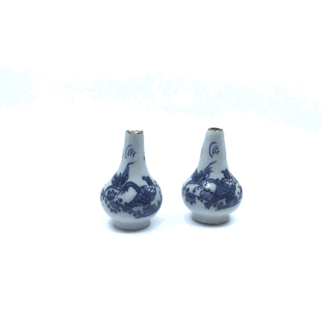 Pair of miniature blue and white bottle vases