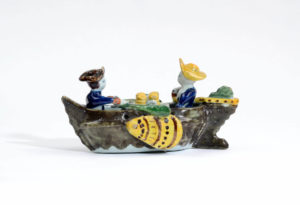 Polychrome Group Of Couple In Boat