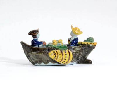 Polychrome Group Of Couple In Boat