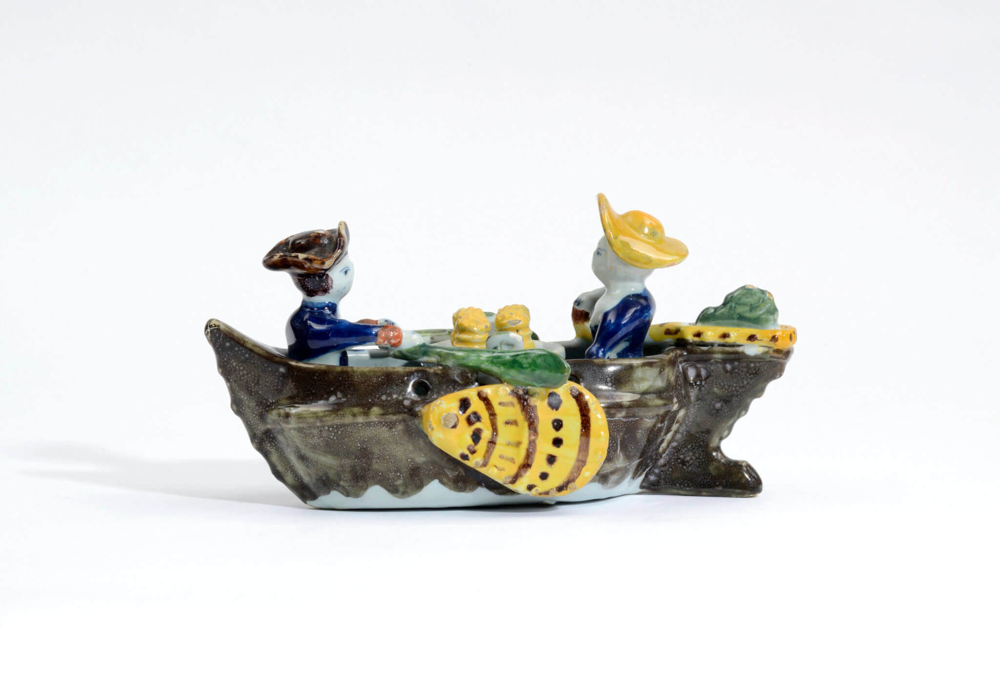 Polychrome group of couple in boat