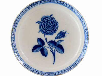 Blue And White Delftware Plate With Rose Stem