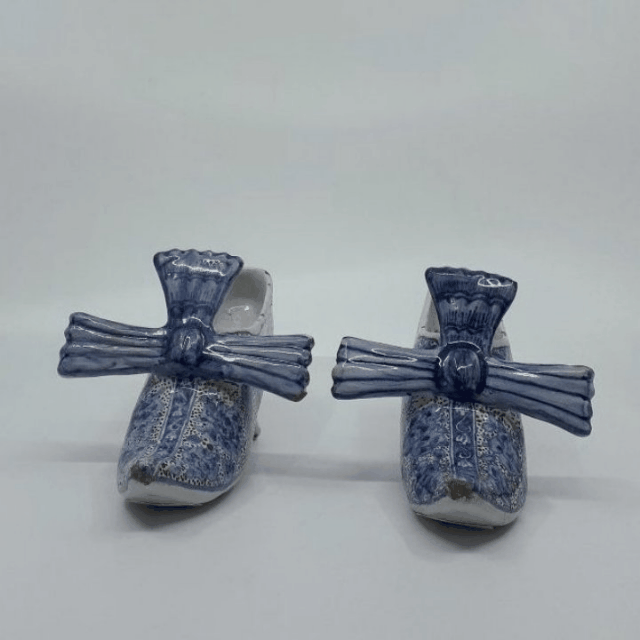 Delftware polychrome models of shoes bows