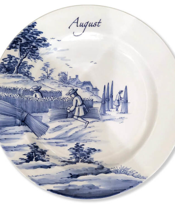 Blue and white modern Delftware plate with three men harvesting and bundling hay