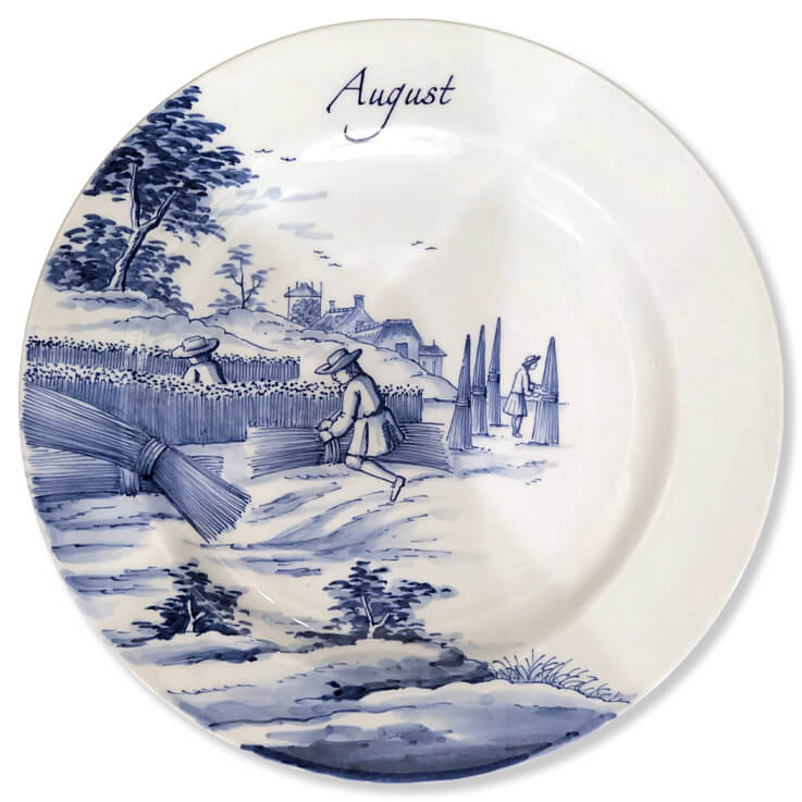 Blue and white modern Delftware plate with three men harvesting and bundling hay