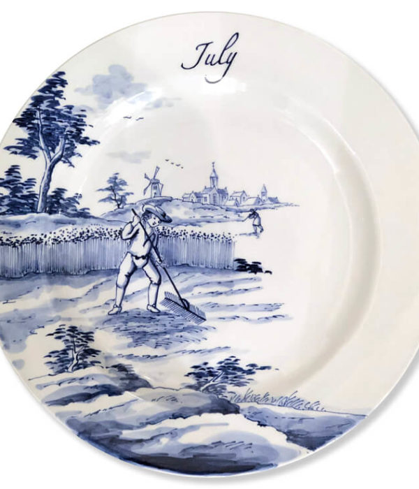 Modern Blue and white Delftware plate with a harvester raking hay while another drinks from a bottle