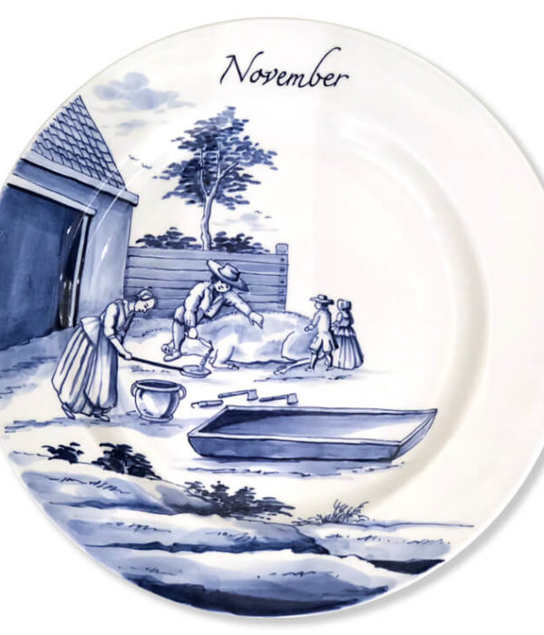 Blue and white modern Delftware plate with two children watching their father and mother bleed a pig