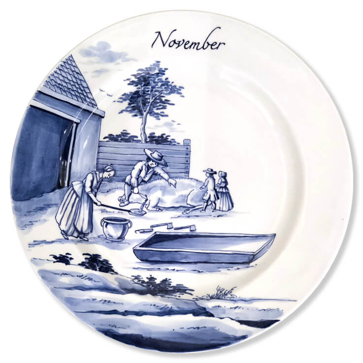 Blue and white modern Delftware plate with two children watching their father and mother bleed a pig