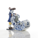•D2084. Polychrome Group Of A Man Pushing A Sleigh