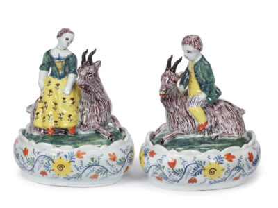 D2358. Pair Of Oval Butter Tubs And Covers With A Girl And Boy Seated On A Goat