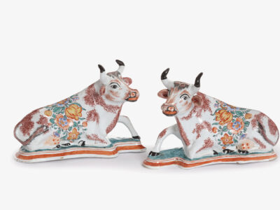 D2350. Pair Of Polychrome Petit Feu And Gilded Figures Of Recumbent Cows