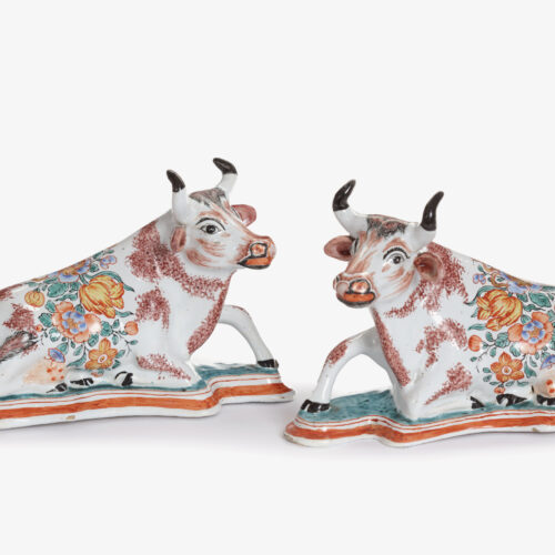 D2350. Pair Of Polychrome Petit Feu And Gilded Figures Of Recumbent Cows